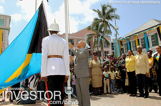 Governor General Sir Arthur Foulkes raises the flag