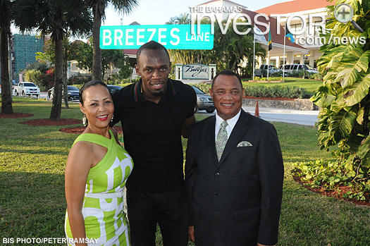 Jamaican track star Usain Bolt (centre), is pictured with Prime Minister Perry Christie and his wife Bernadette